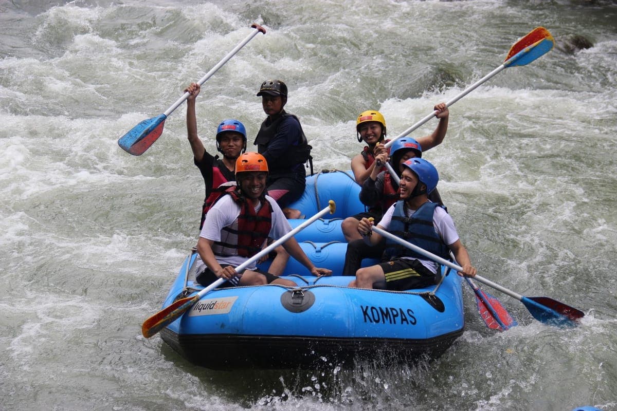 Rafters passing a carved-stone river wall